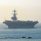The aircraft carrier USS George H.W. Bush arrives for a of four-day stop in the harbour of Marseille, southern France, Saturday, Nov. 1, 2014. The vessel took part in the mission Enduring Freedom in Afghanistan and against the Islamic State group in Iraq. (AP Photo/Claude Paris)